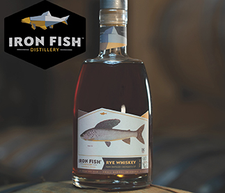 Botle of whiskey with Iron Fish Distillery logo